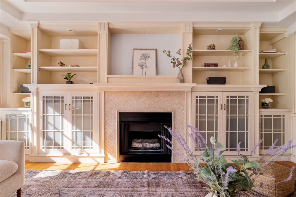 169 Commonwealth Avenue, Unit 5 Boston, MA 02116 - Photo 3 of 31 a living room with furniture and a fireplace
