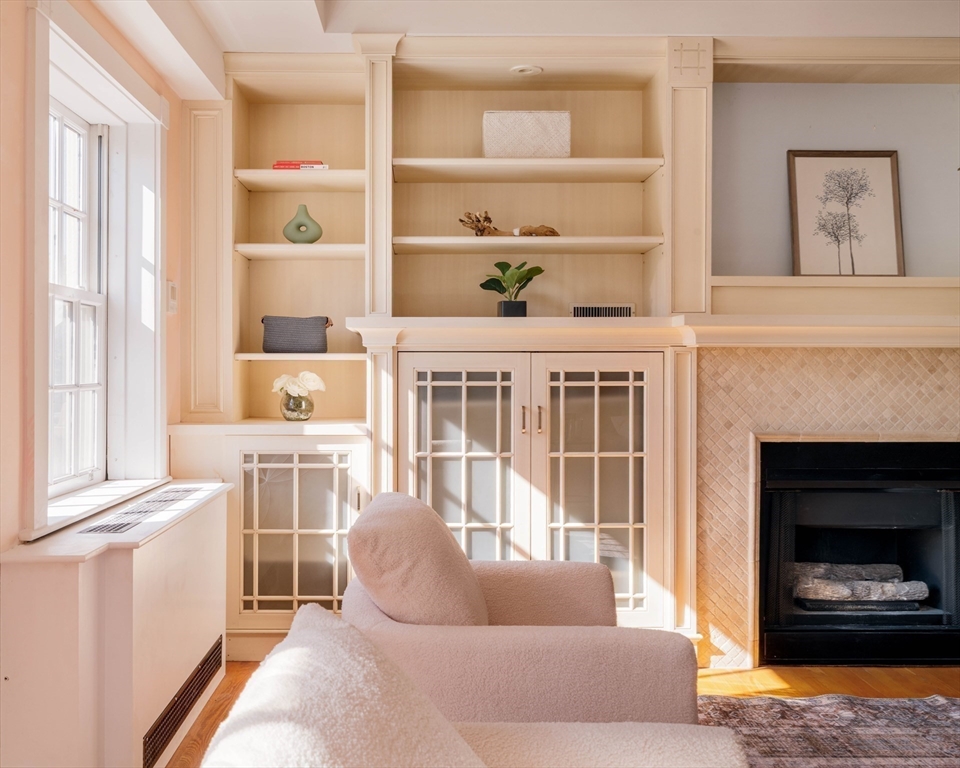 169 Commonwealth Avenue, Unit 5 Boston, MA 02116 - Photo 4 of 31 a living room with furniture and a fireplace