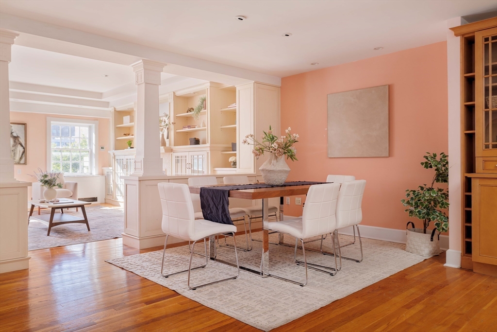 169 Commonwealth Avenue, Unit 5 Boston, MA 02116 - Photo 5 of 31 a dining room with wooden floor and large windows