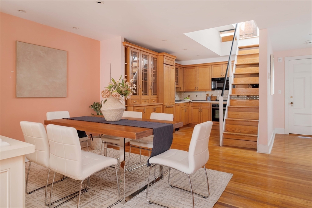169 Commonwealth Avenue, Unit 5 Boston, MA 02116 - Photo 7 of 31 a dining room with furniture and wooden floor