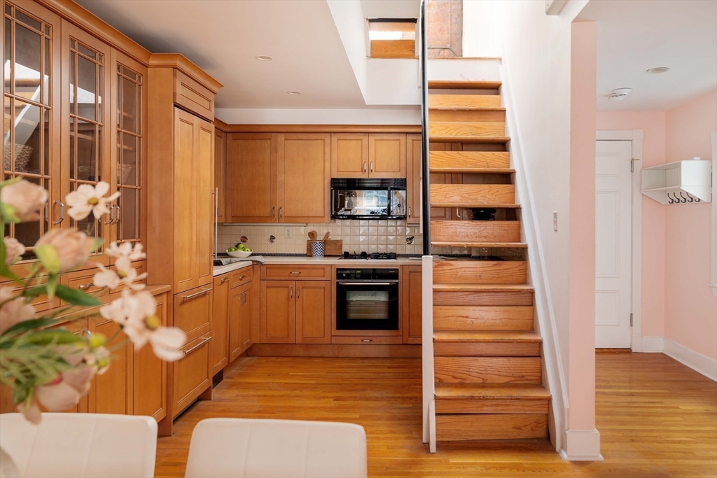 169 Commonwealth Avenue, Unit 5 Boston, MA 02116 - Photo 9 of 31 a kitchen with stainless steel appliances a stove and a refrigerator