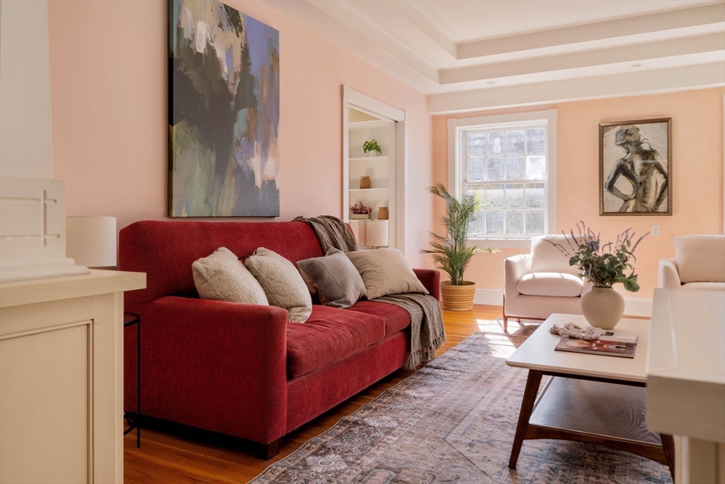 169 Commonwealth Avenue, Unit 5 Boston, MA 02116 - Photo 10 of 31 a living room with furniture and large window