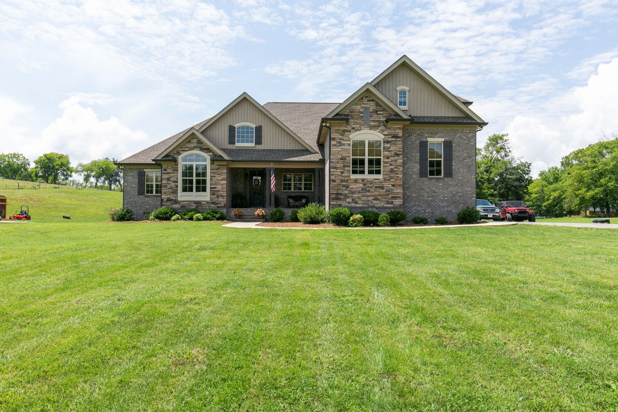 676 Burford Road Lebanon, TN 37087 - Photo 1 of 33 a front view of a house with a yard and trees