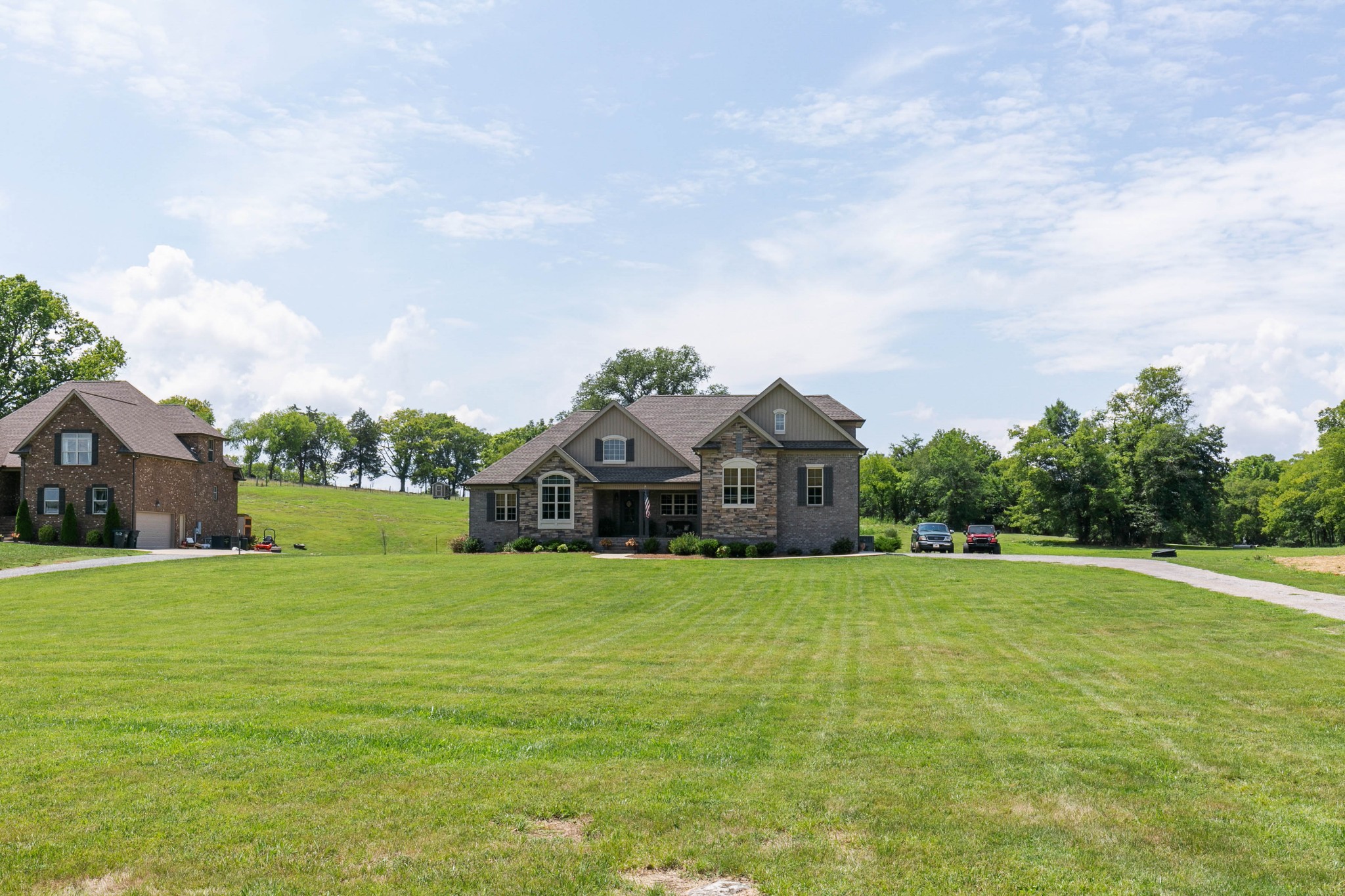 676 Burford Road Lebanon, TN 37087 - Photo 2 of 33 a front view of a house with a yard and garage