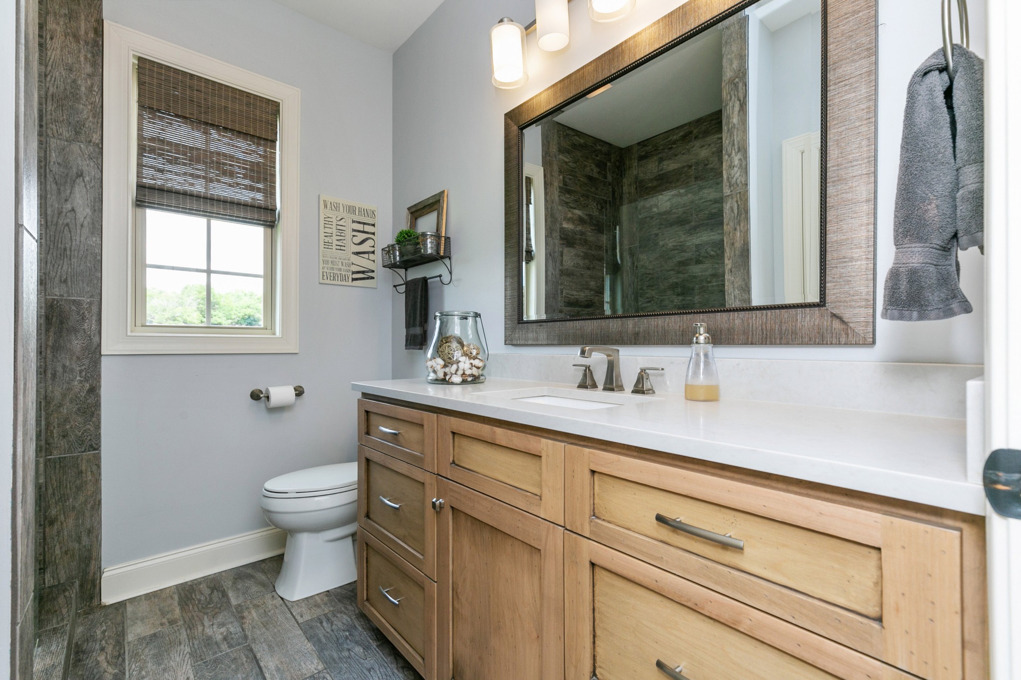676 Burford Road Lebanon, TN 37087 - Photo 27 of 33 a bathroom with a toilet sink and mirror