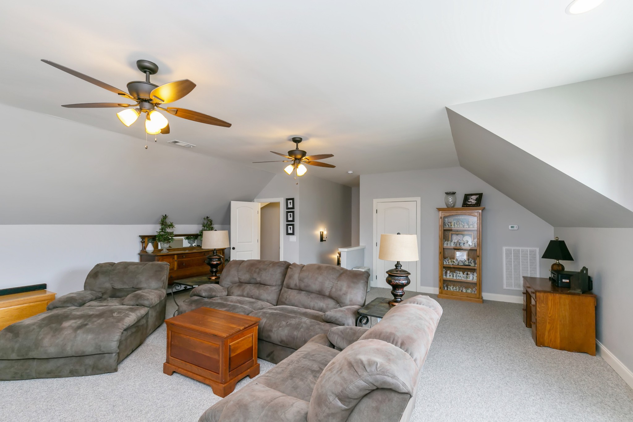 676 Burford Road Lebanon, TN 37087 - Photo 29 of 33 a living room with furniture ceiling fan and a wooden floor