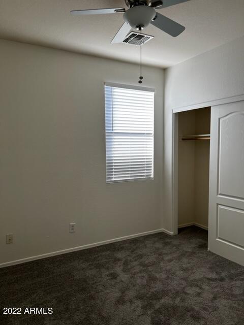 4311 South Splendor Place Gilbert, AZ 85297 - Photo 18 of 24 a view of a livingroom with a ceiling fan and window