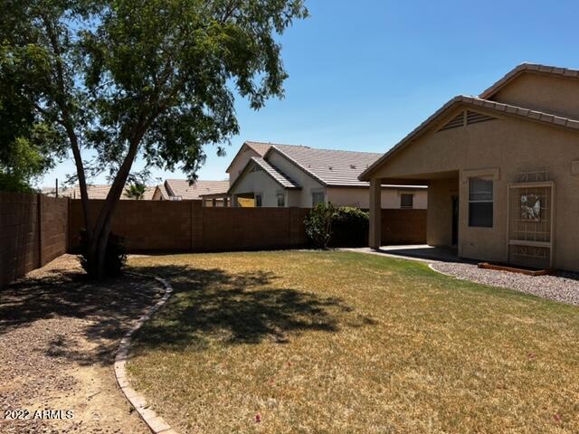 4311 South Splendor Place Gilbert, AZ 85297 - Photo 2 of 24 a front view of a house with a yard