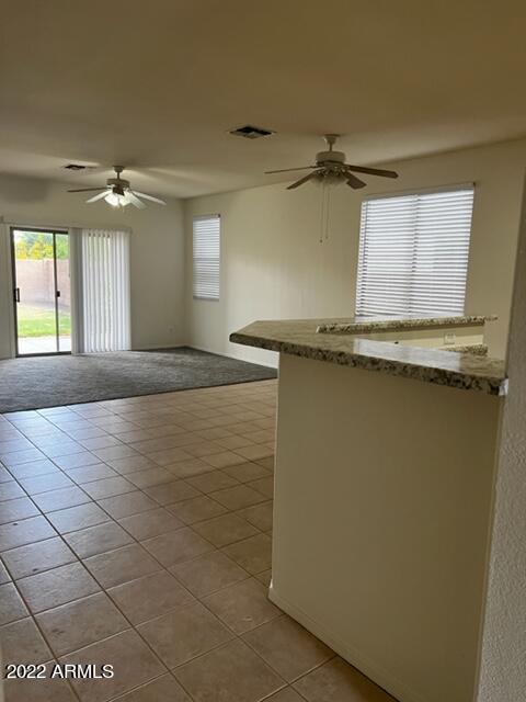 4311 South Splendor Place Gilbert, AZ 85297 - Photo 3 of 24 a view of a kitchen with a sink and dishwasher
