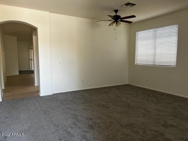 4311 South Splendor Place Gilbert, AZ 85297 - Photo 4 of 24 an empty room with a window and a ceiling fan