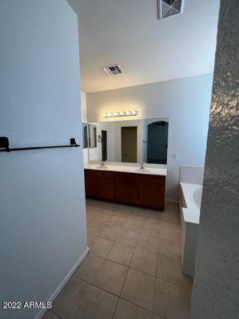 4311 South Splendor Place Gilbert, AZ 85297 - Photo 8 of 24 a view of a kitchen with an empty space and a window