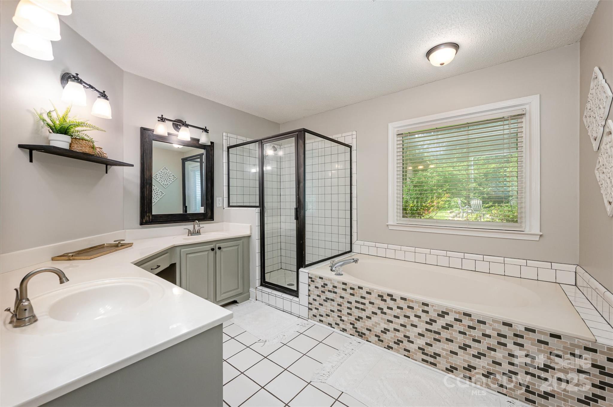 105 Banksridge Road Fort Mill, SC 29715 - Photo 12 of 30 a bathroom with a double vanity sink mirror and bathtub