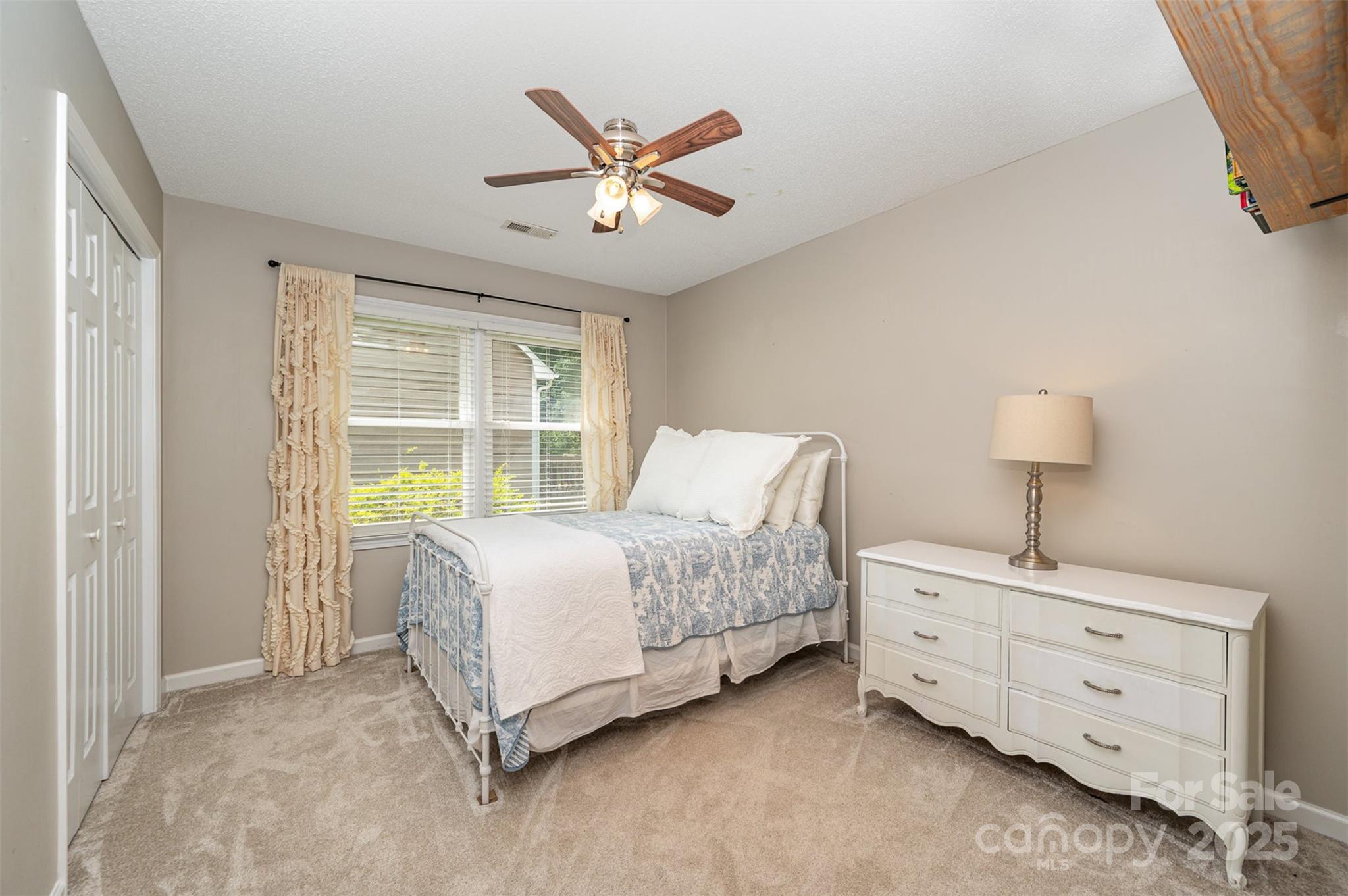 105 Banksridge Road Fort Mill, SC 29715 - Photo 13 of 30 a bedroom with a bed and a window