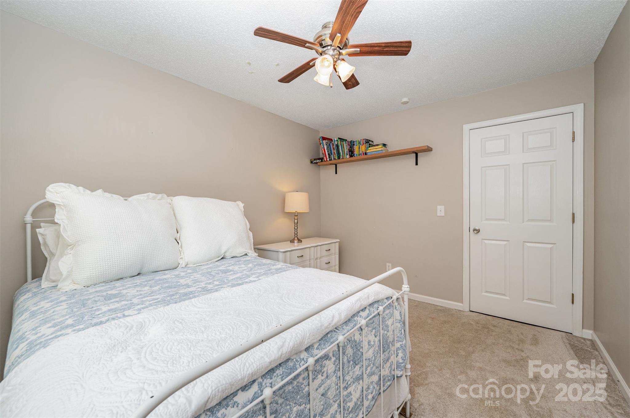 105 Banksridge Road Fort Mill, SC 29715 - Photo 14 of 30 a bedroom with a bed and a ceiling fan