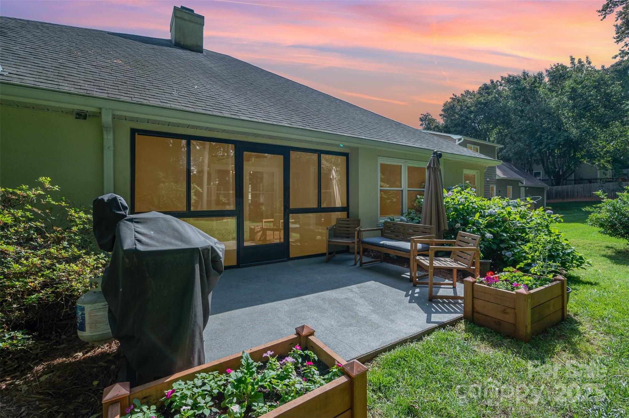 105 Banksridge Road Fort Mill, SC 29715 - Photo 23 of 30 a view of a backyard with sitting area and garden