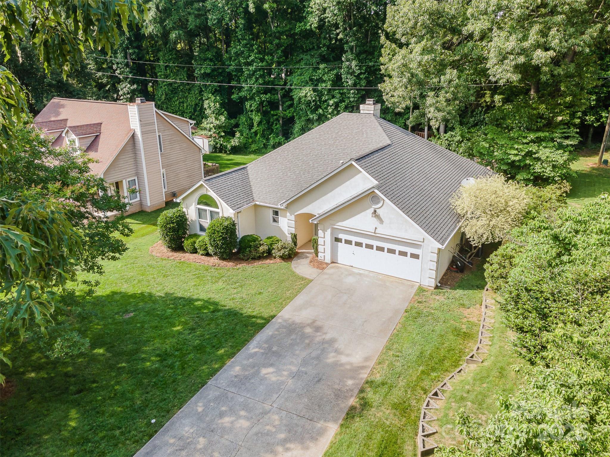 105 Banksridge Road Fort Mill, SC 29715 - Photo 28 of 30 a view of a house with a yard plants and large tree