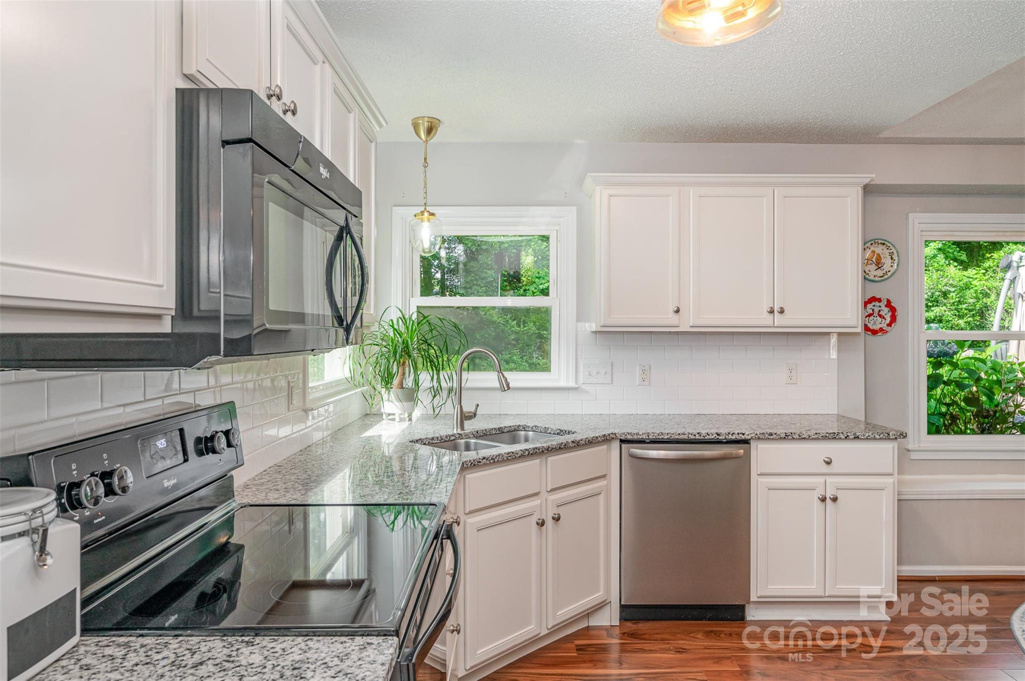 105 Banksridge Road Fort Mill, SC 29715 - Photo 6 of 30 a kitchen with stainless steel appliances granite countertop a sink stove and cabinets