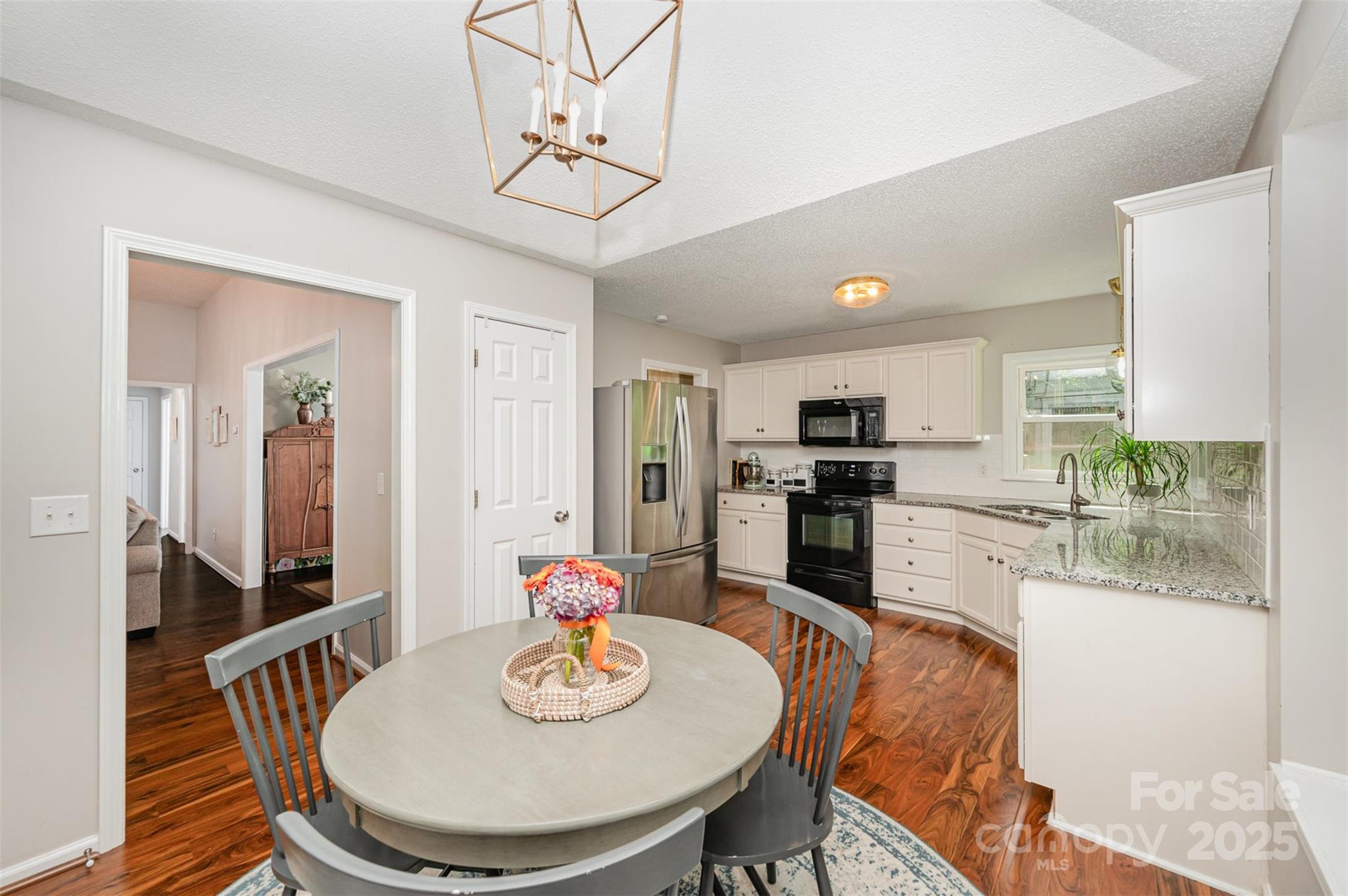 105 Banksridge Road Fort Mill, SC 29715 - Photo 9 of 30 a kitchen with a dining table and chairs