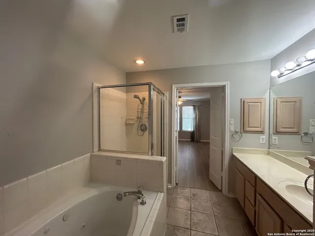 a bathroom with a bathtub and a sink