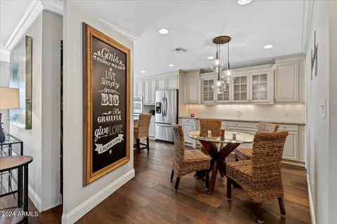 a kitchen with granite countertop a sink stainless steel appliances and cabinets