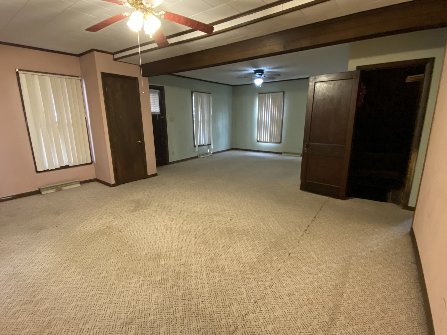 111 East Elm Street Fairbury, IL 61739 - Photo 2 of 11 a view of an empty room with a chandelier fan
