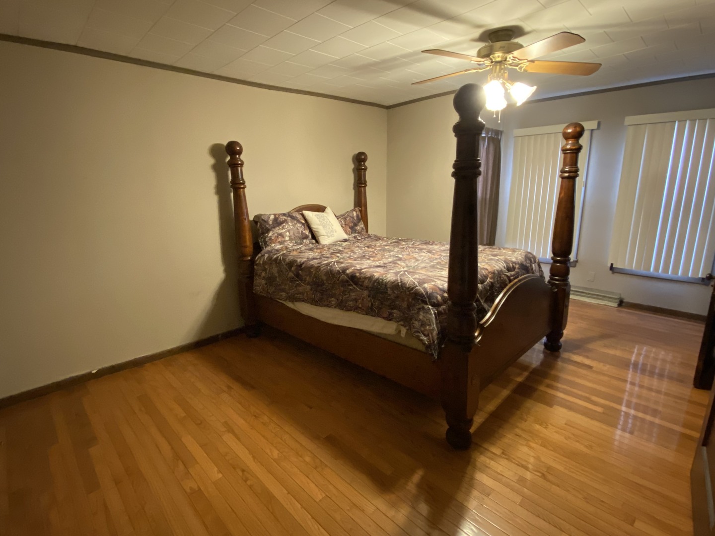 111 East Elm Street Fairbury, IL 61739 - Photo 7 of 11 a bed sitting in a room next to a window
