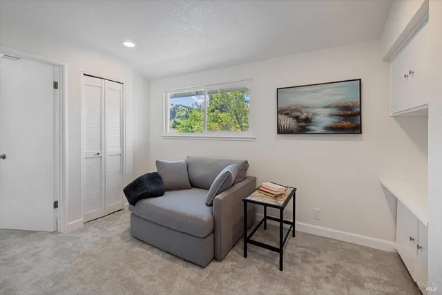 a spacious bedroom with a bed and a window