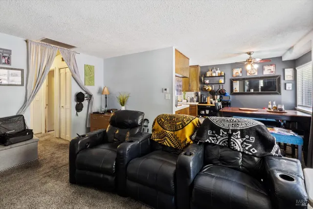 a view of a house with porch and garden