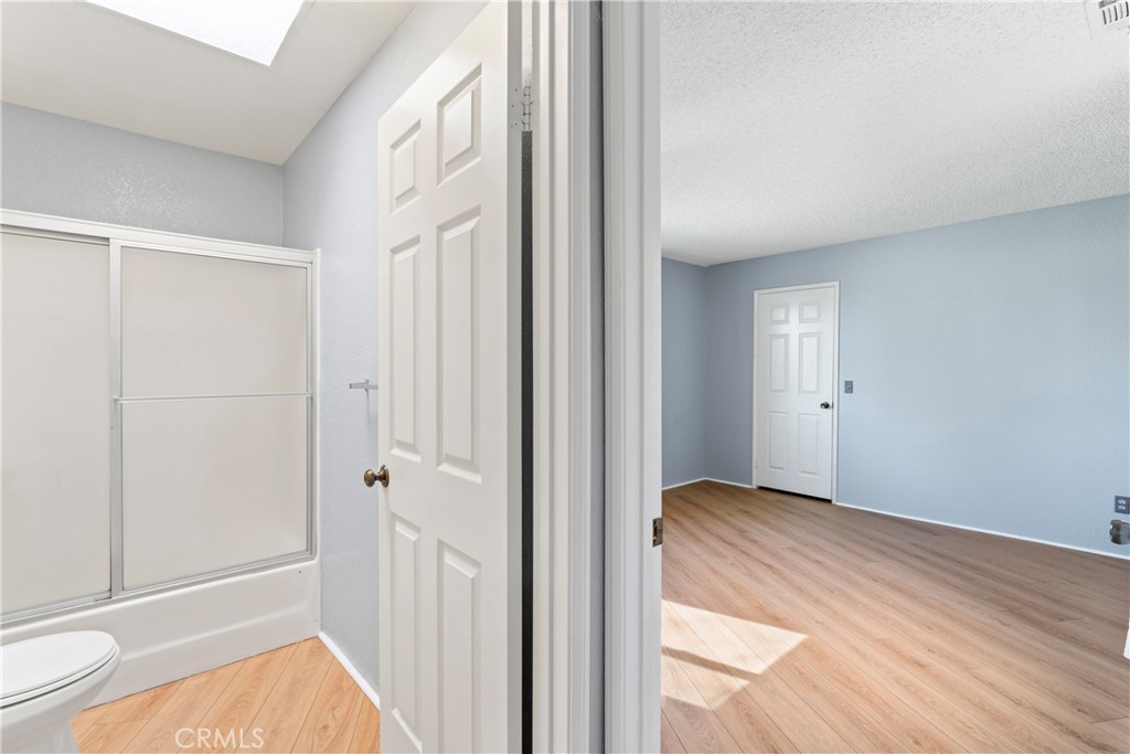 1068 Occidental Circle Redlands, CA 92374 - Photo 15 of 26 a view of hallway with bathroom