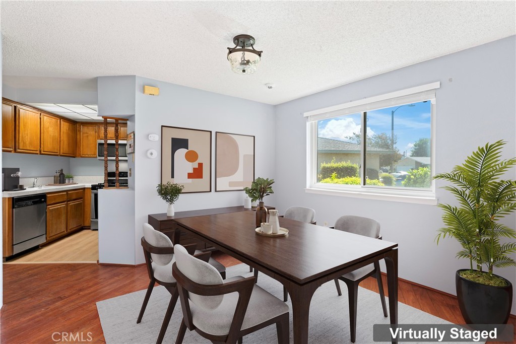 1068 Occidental Circle Redlands, CA 92374 - Photo 5 of 26 a view of a dining room with furniture window and wooden floor