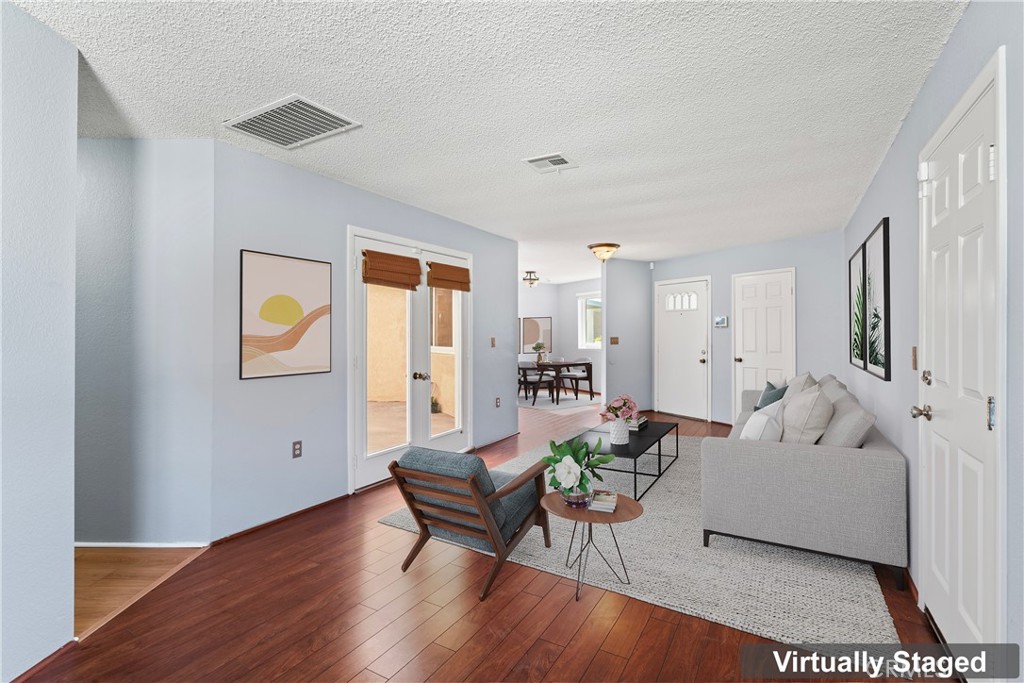 1068 Occidental Circle Redlands, CA 92374 - Photo 7 of 26 a living room with furniture and wooden floor