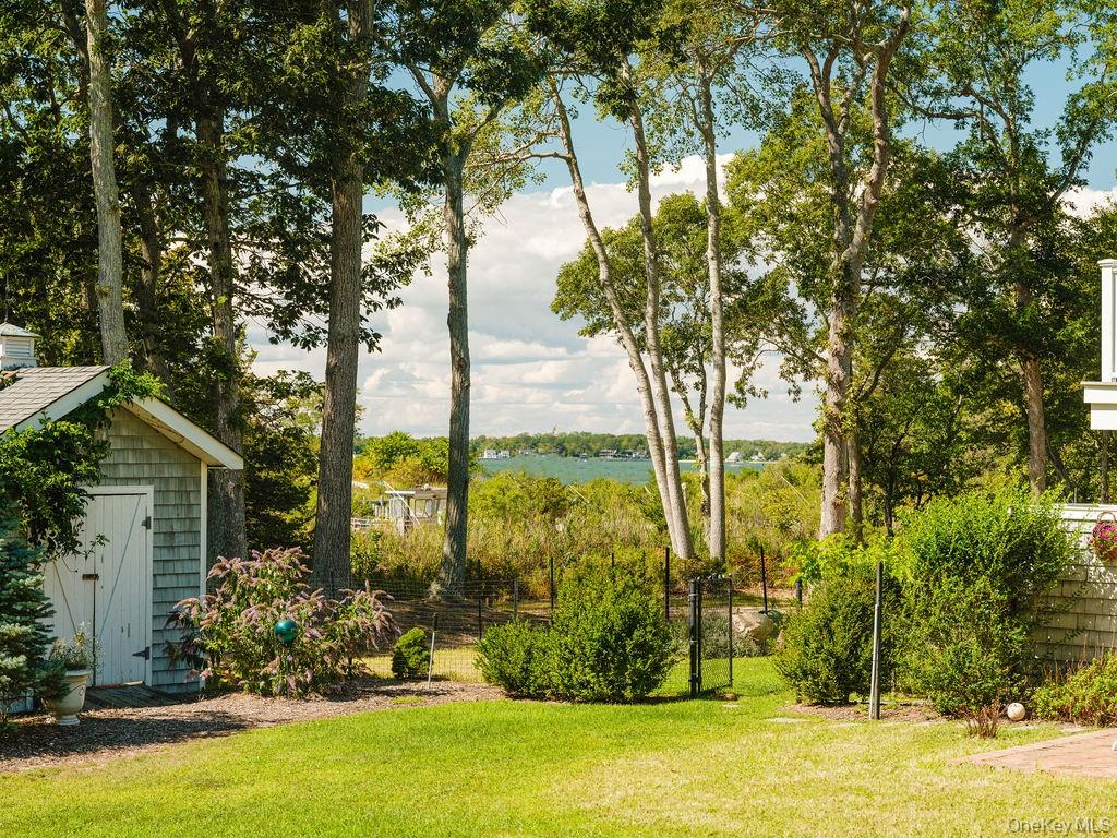 10947 North Bayview Road Southold, NY 11971 - Photo 11 of 43 View of yard with a storage shed and a water view