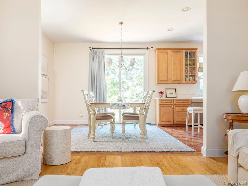 10947 North Bayview Road Southold, NY 11971 - Photo 23 of 43 Dining area with a chandelier, healthy amount of natural light, light wood-style floors, and recessed lighting