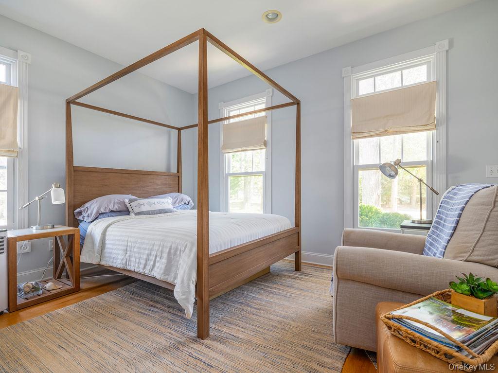 10947 North Bayview Road Southold, NY 11971 - Photo 37 of 43 Bedroom featuring baseboards and wood finished floors
