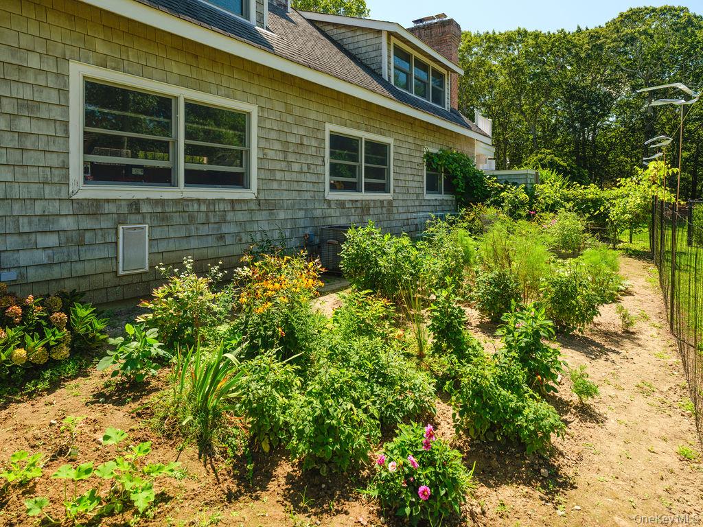 10947 North Bayview Road Southold, NY 11971 - Photo 9 of 43 View of side of home featuring a chimney