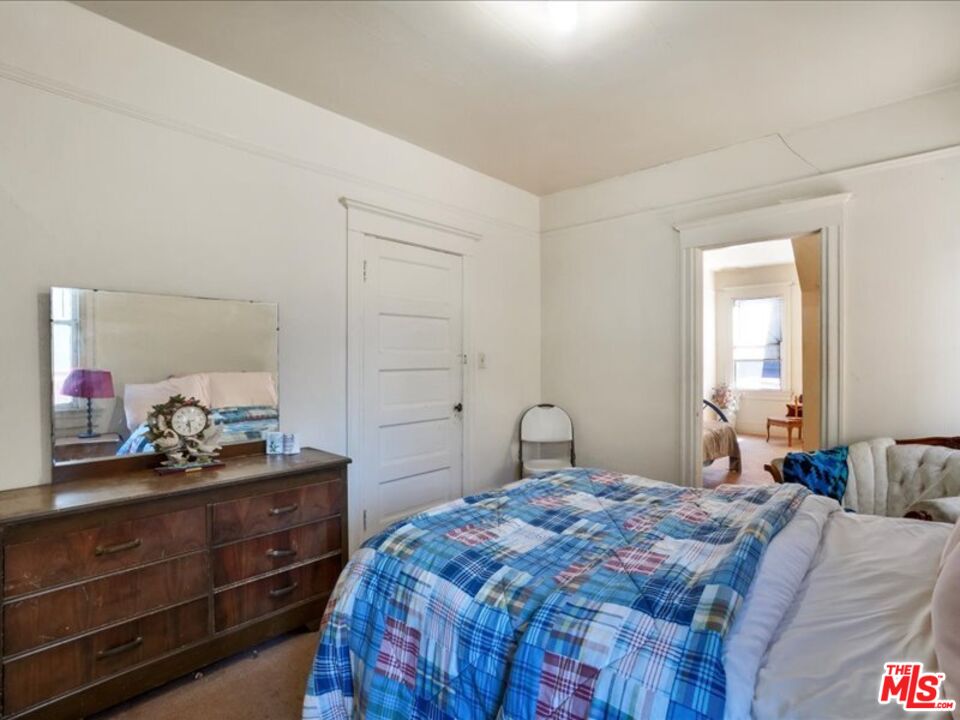 2057 Emerson Street Berkeley, CA 94703 - Photo 17 of 37 a bedroom with a bed and closet