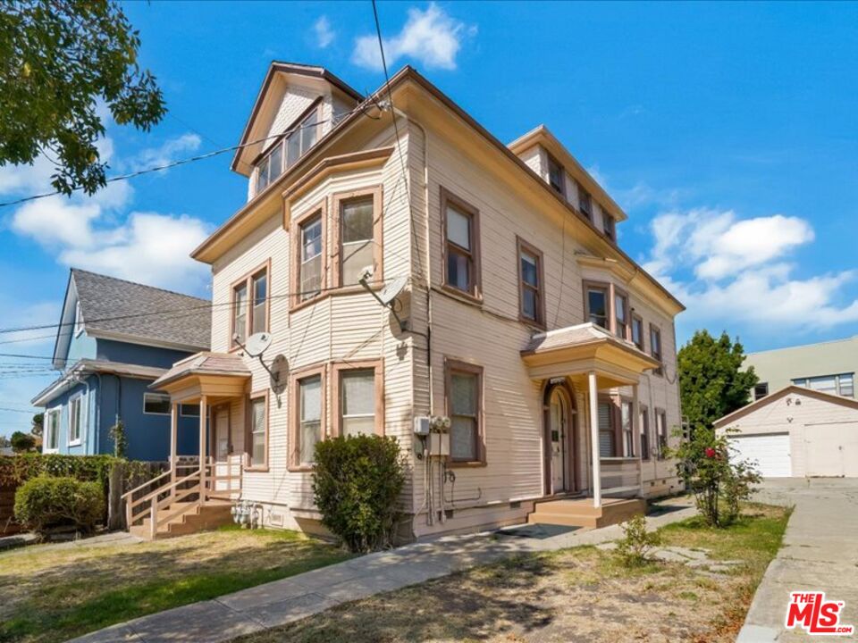 2057 Emerson Street Berkeley, CA 94703 - Photo 2 of 37 a front view of a house with a yard