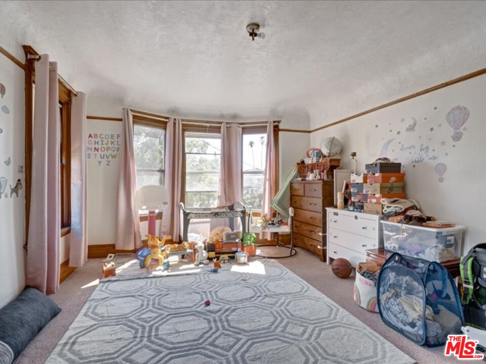 2057 Emerson Street Berkeley, CA 94703 - Photo 21 of 37 a view of a livingroom with furniture and a window
