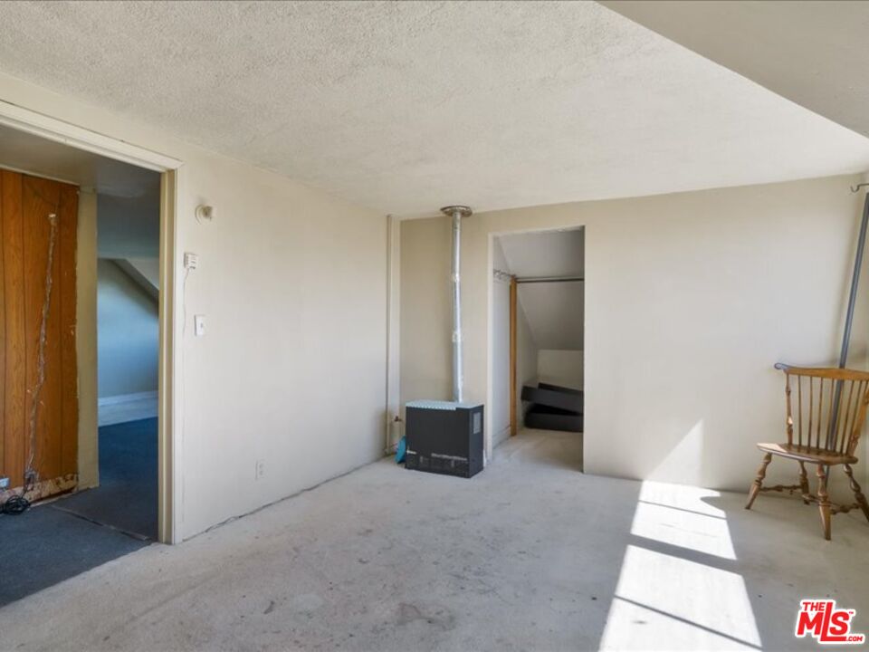 2057 Emerson Street Berkeley, CA 94703 - Photo 30 of 37 an entryway and a livingroom with furniture