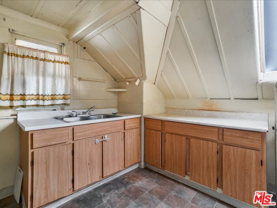 2057 Emerson Street Berkeley, CA 94703 - Photo 34 of 37 a kitchen with sink and cabinets
