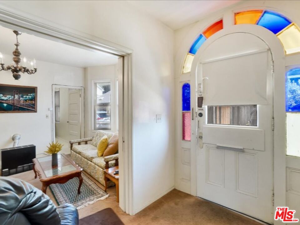 2057 Emerson Street Berkeley, CA 94703 - Photo 4 of 37 a living room with furniture and a wooden floor