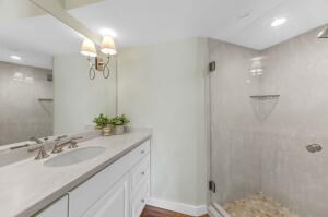 1114 Orleans Road, Unit 2 Chatham, MA 02650 - Photo 17 of 38 a bathroom with a sink and a mirror