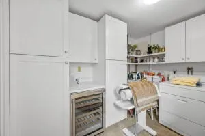 a room with a workspace and a window