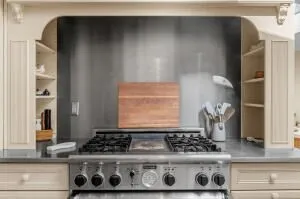 a kitchen with a stove and a cabinet