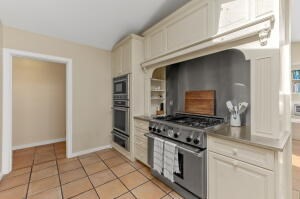 1114 Orleans Road, Unit 2 Chatham, MA 02650 - Photo 21 of 38 a kitchen with granite countertop a stove and a sink
