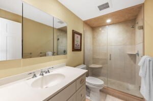 1114 Orleans Road, Unit 2 Chatham, MA 02650 - Photo 22 of 38 a bathroom with a sink toilet and shower