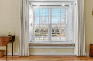 a living room that has a window and a wooden floor