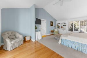 1114 Orleans Road, Unit 2 Chatham, MA 02650 - Photo 27 of 38 a bedroom with furniture and a couch