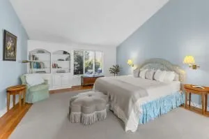 a bedroom with a bed and window