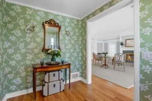 a view of a livingroom with furniture and a table in it